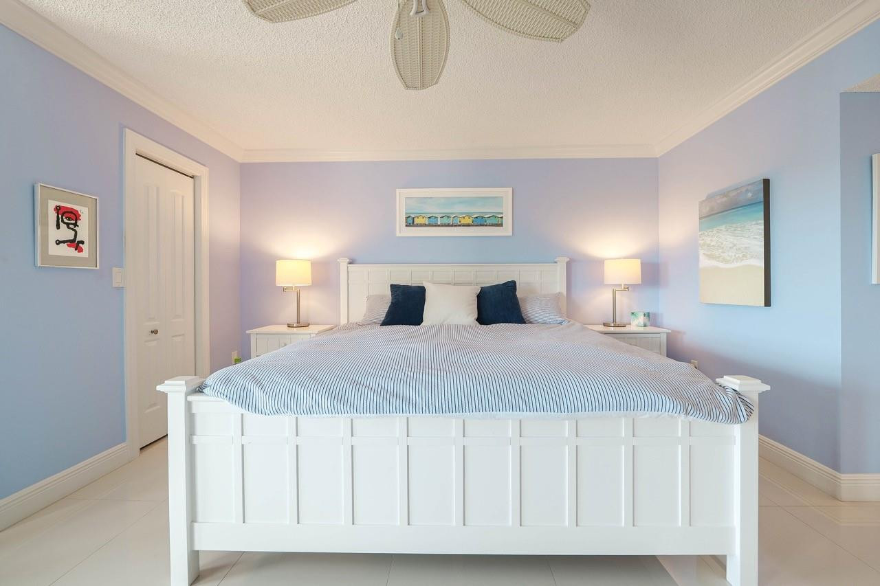 3930 Inverrary Boulevard, Unit 603D Lauderhill, FL 33319 - Photo 25 of 74 a bedroom with a bed and a painting