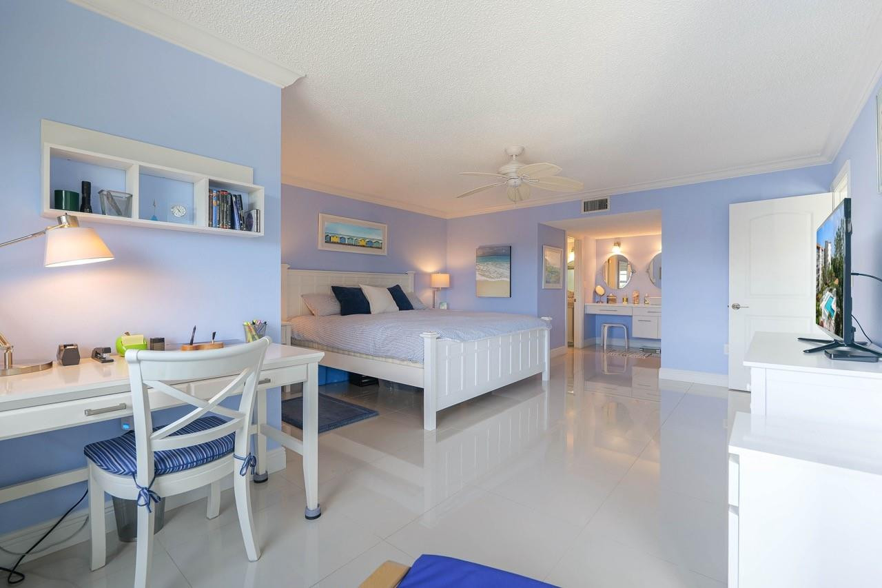 3930 Inverrary Boulevard, Unit 603D Lauderhill, FL 33319 - Photo 26 of 74 a living room with furniture a fireplace and a flat screen tv