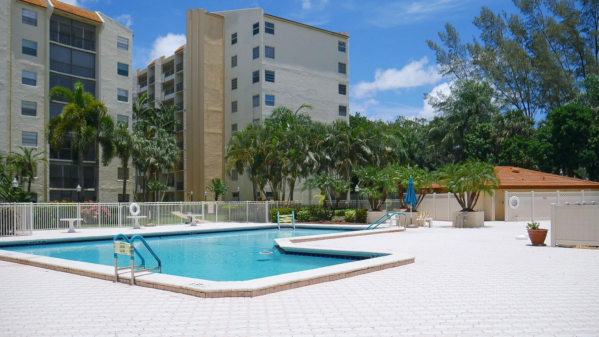 3930 Inverrary Boulevard, Unit 603D Lauderhill, FL 33319 - Photo 70 of 74 a view of a building with a swimming pool