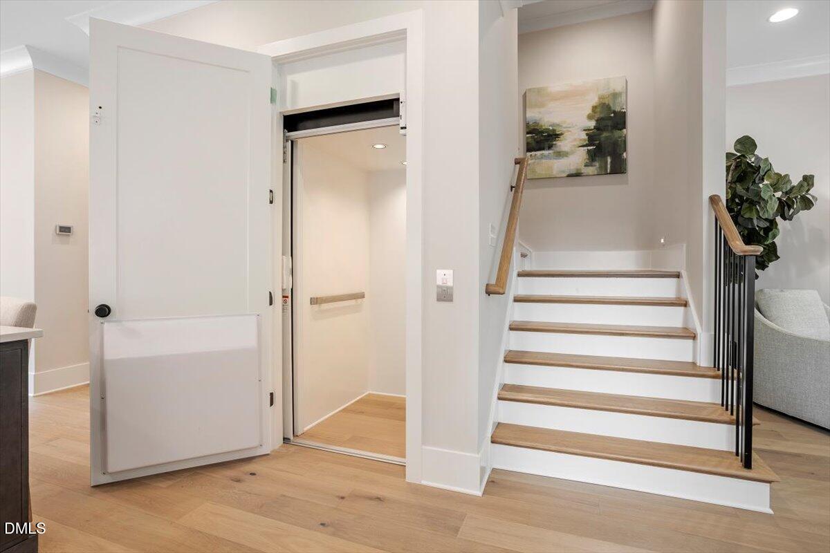 811 Maple Berry Lane, Unit 101 Raleigh, NC 27607 - Photo 22 of 45 a view of a hallway with wooden floor and entryway