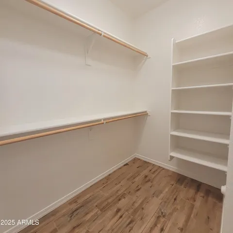 a view of an empty walk in closet