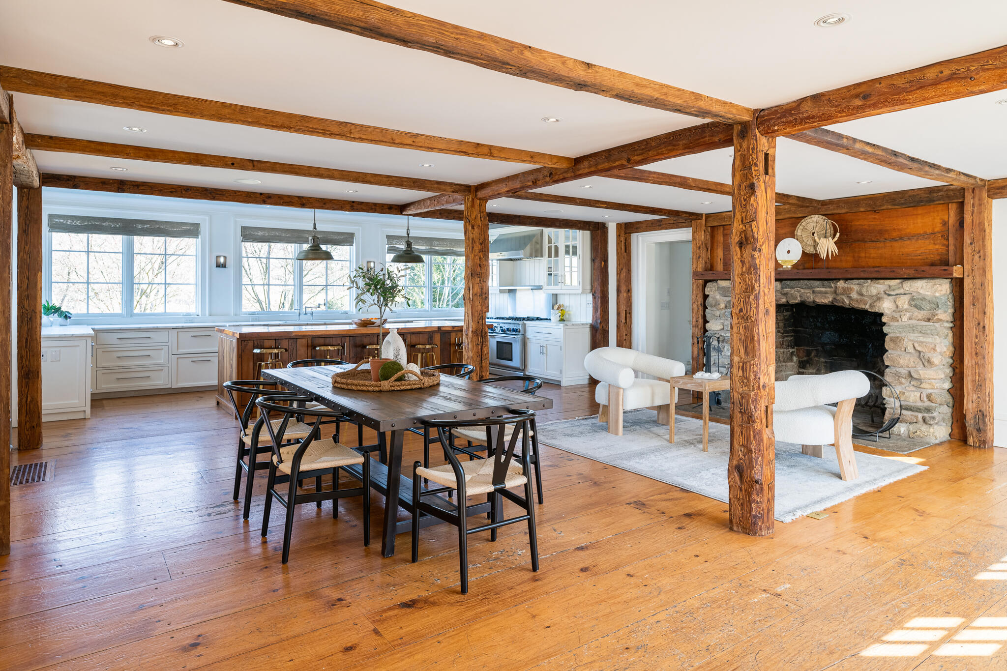 98 Pear Tree Point Road Darien, CT 06820 - Photo 11 of 42 a view of a dining room and livingroom with furniture wooden floor a chandelier
