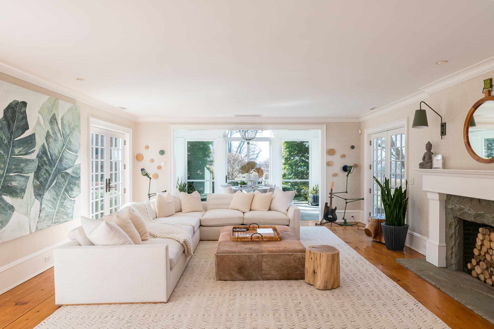 98 Pear Tree Point Road Darien, CT 06820 - Photo 12 of 42 a living room with furniture a fireplace and a large window