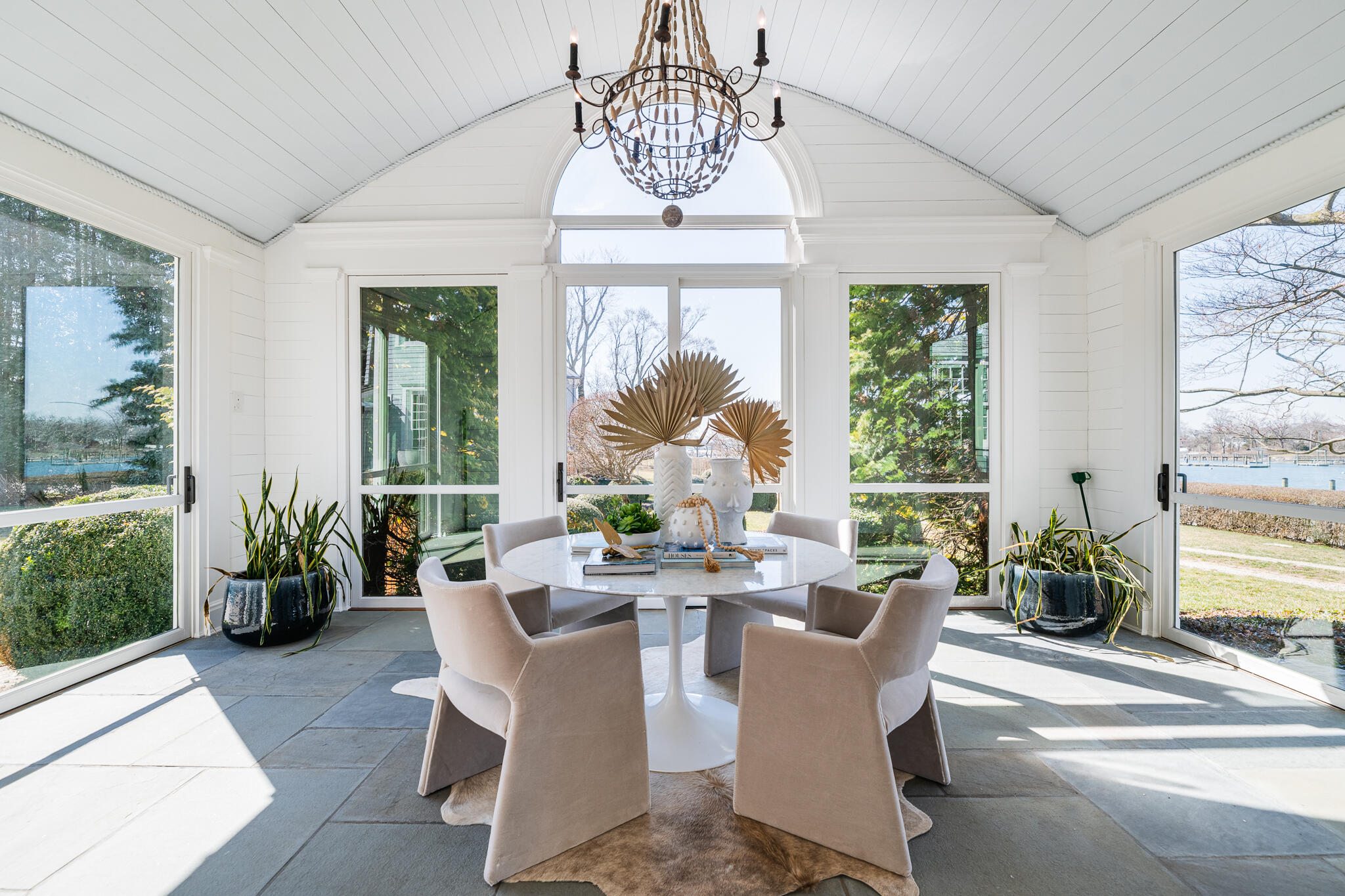 98 Pear Tree Point Road Darien, CT 06820 - Photo 14 of 42 a view of a dining room with furniture window and outside view