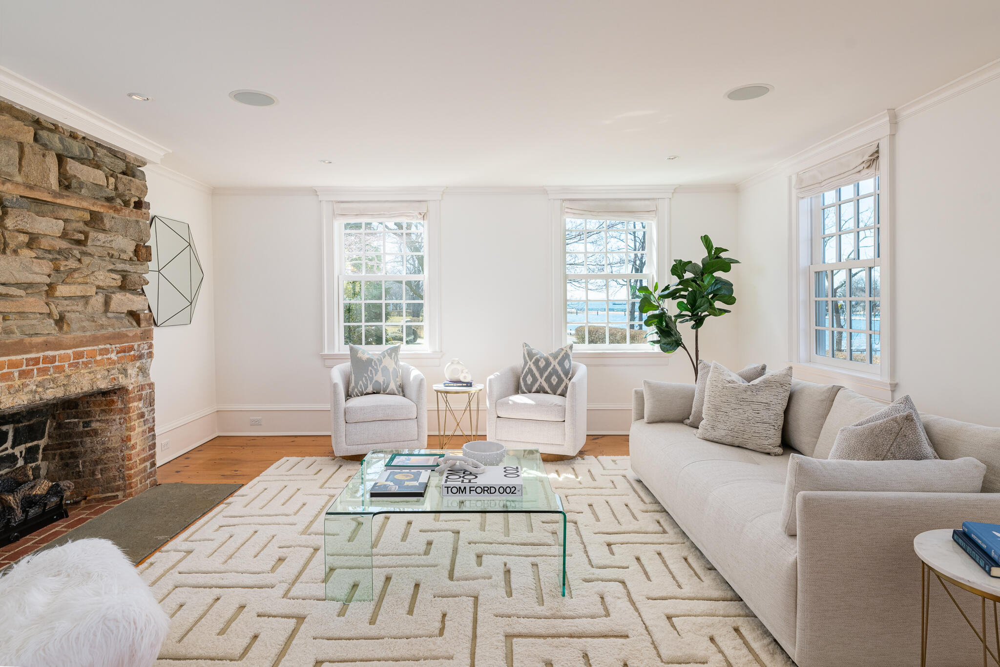 98 Pear Tree Point Road Darien, CT 06820 - Photo 15 of 42 a living room with furniture and a fireplace