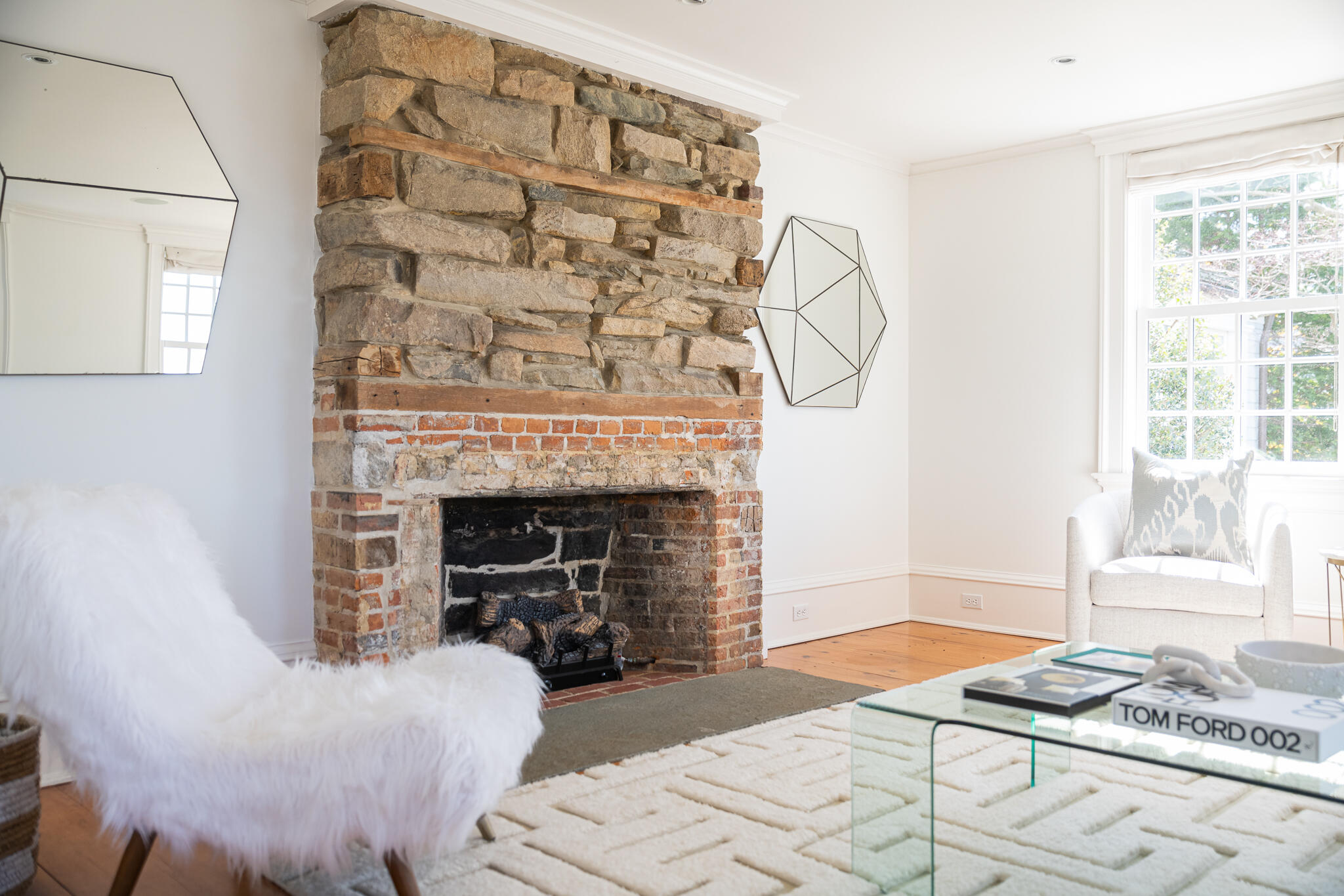 98 Pear Tree Point Road Darien, CT 06820 - Photo 16 of 42 a living room with furniture and a fireplace