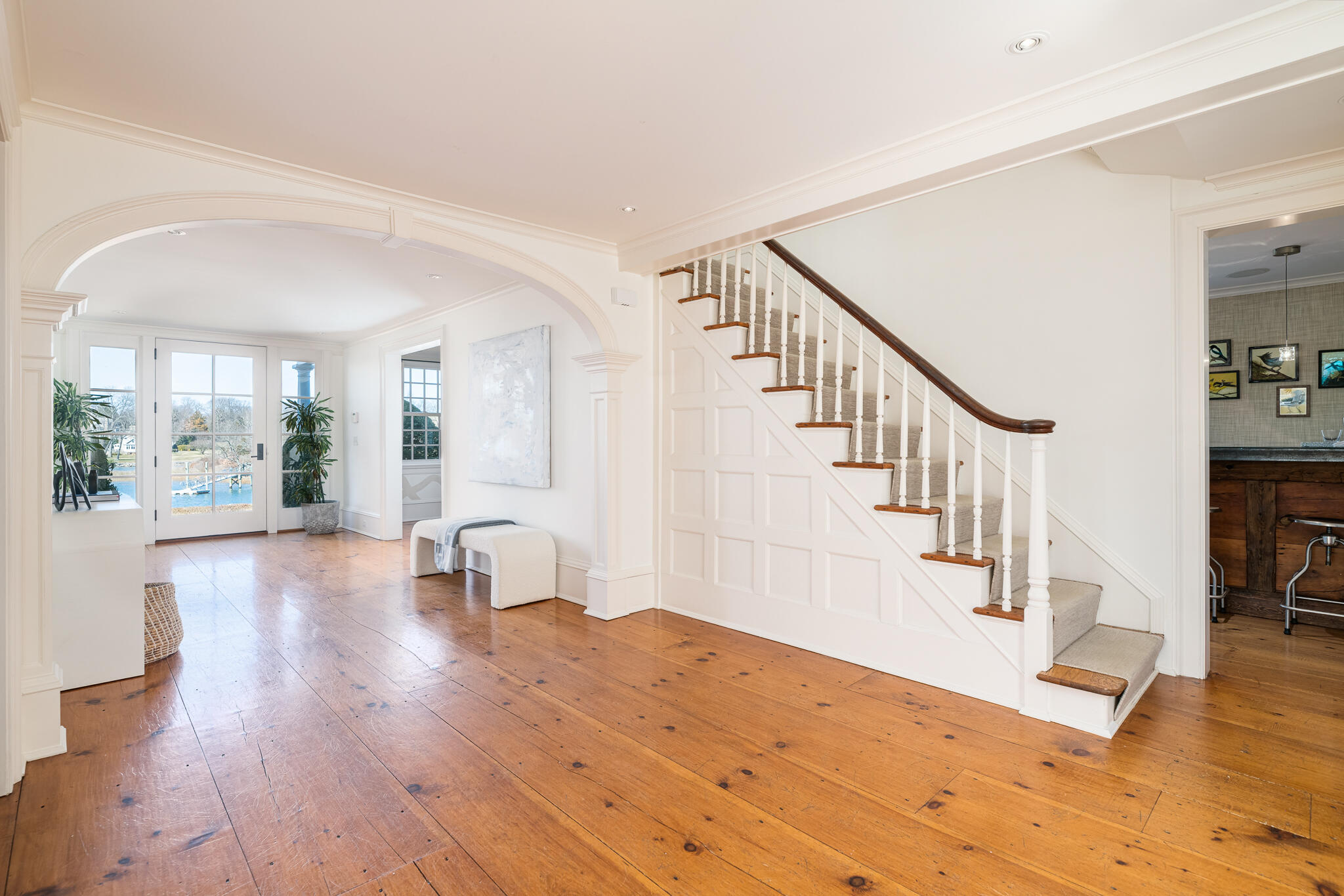 98 Pear Tree Point Road Darien, CT 06820 - Photo 19 of 42 a view of entryway and hall with wooden floor