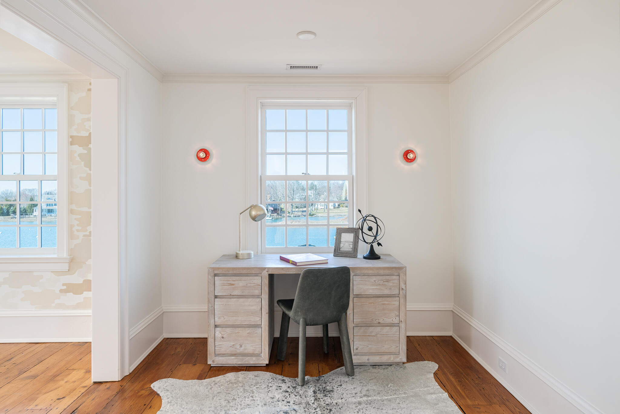 98 Pear Tree Point Road Darien, CT 06820 - Photo 20 of 42 a view of a workspace with furniture and a window