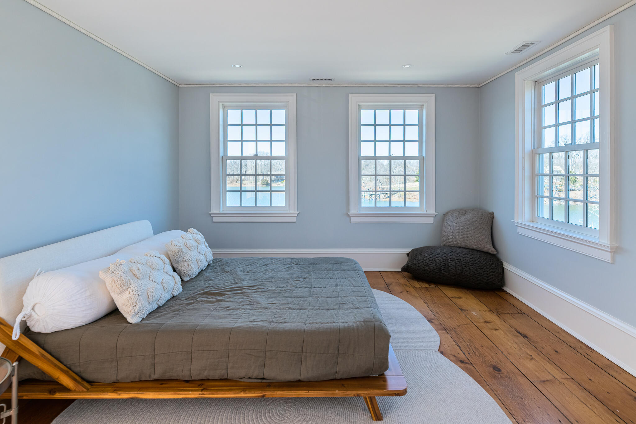 98 Pear Tree Point Road Darien, CT 06820 - Photo 24 of 42 a bedroom with a bed window and couch