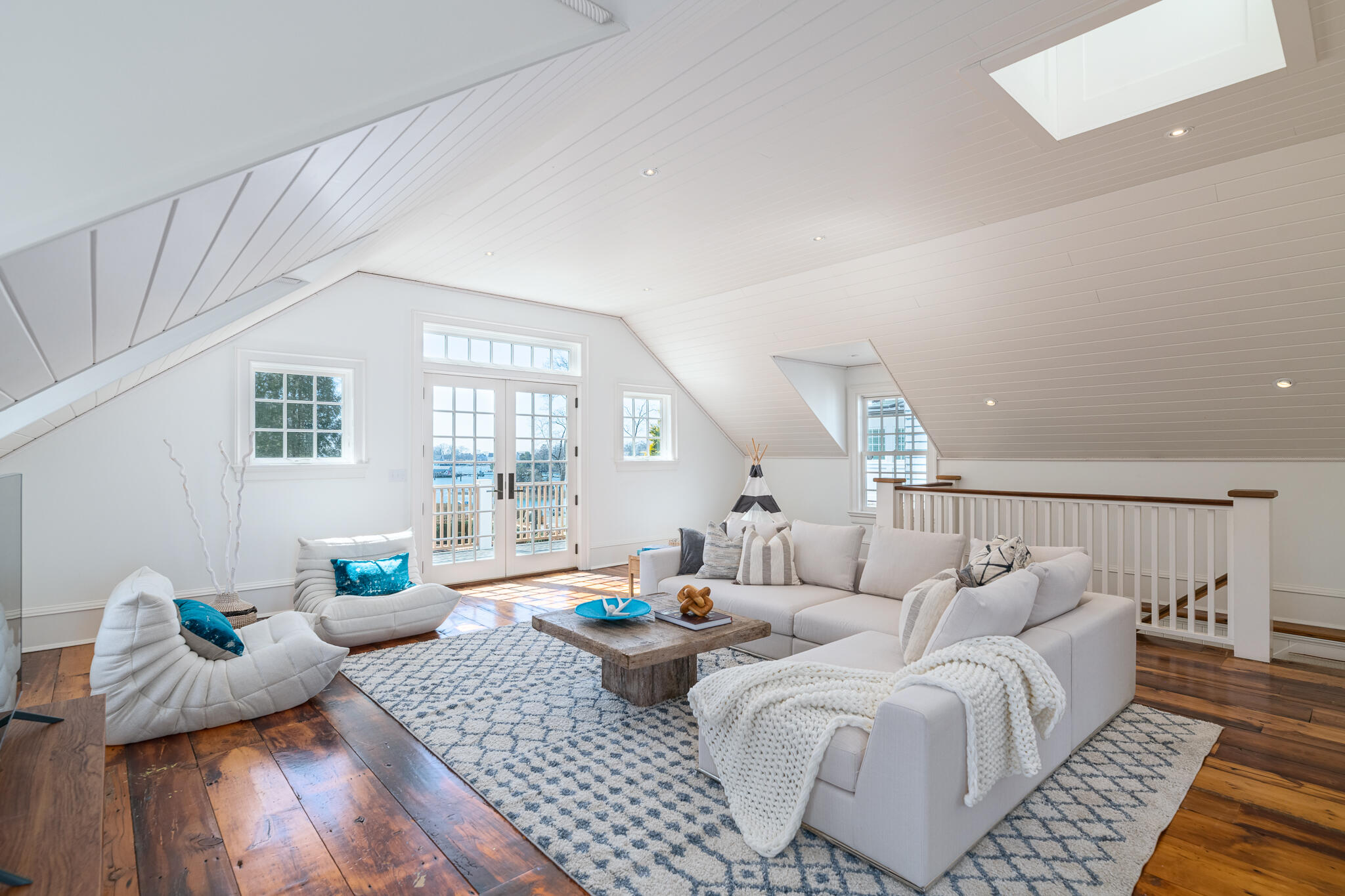 98 Pear Tree Point Road Darien, CT 06820 - Photo 31 of 42 a living room with furniture or couch and a wooden floor