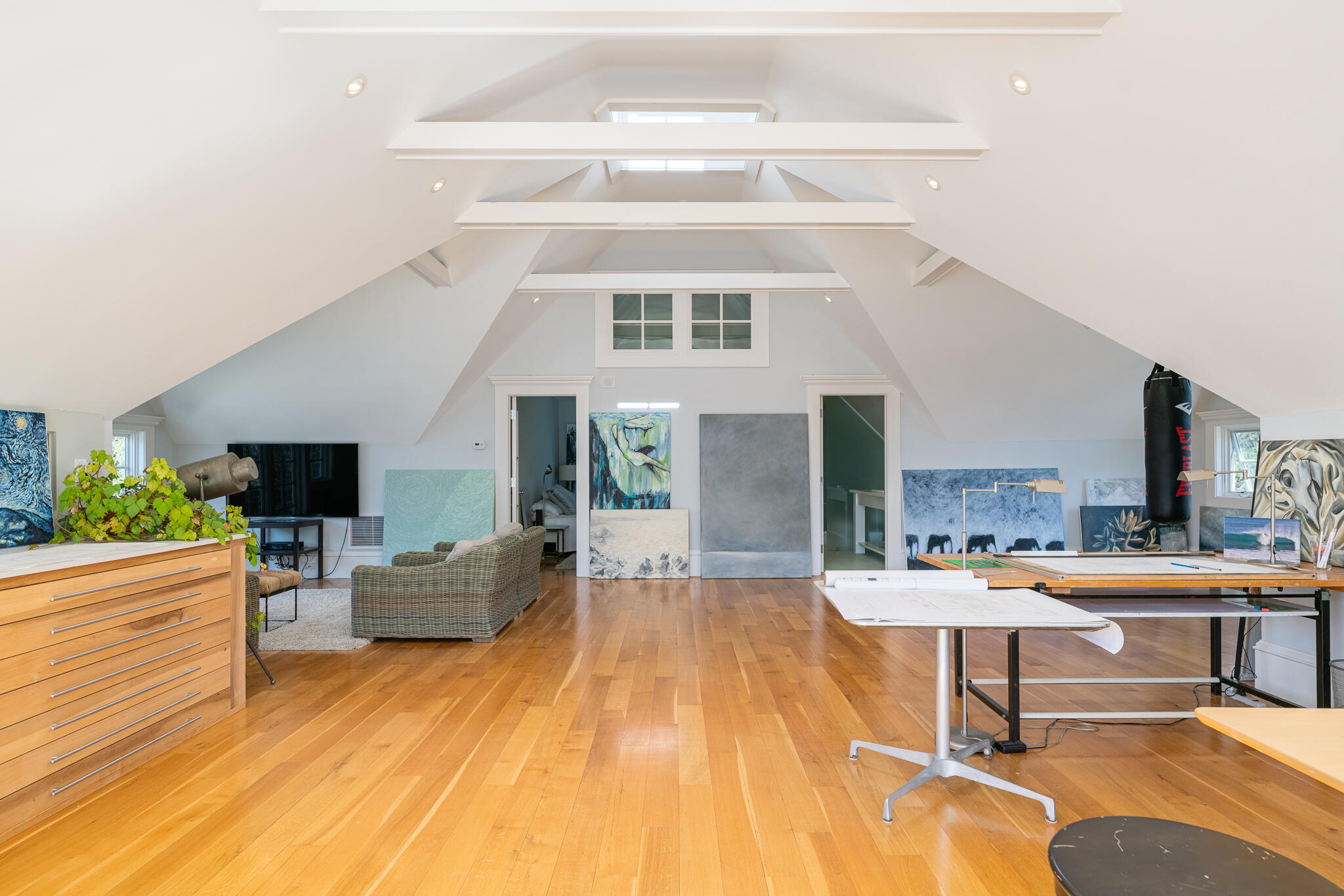 98 Pear Tree Point Road Darien, CT 06820 - Photo 33 of 42 a living room with furniture and a wooden floor