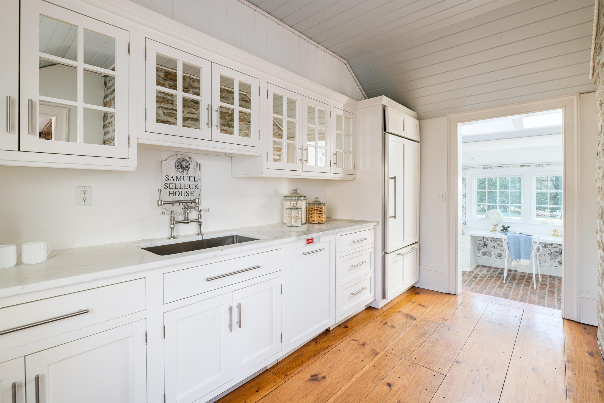 98 Pear Tree Point Road Darien, CT 06820 - Photo 7 of 42 a kitchen with granite countertop white cabinets and white appliances