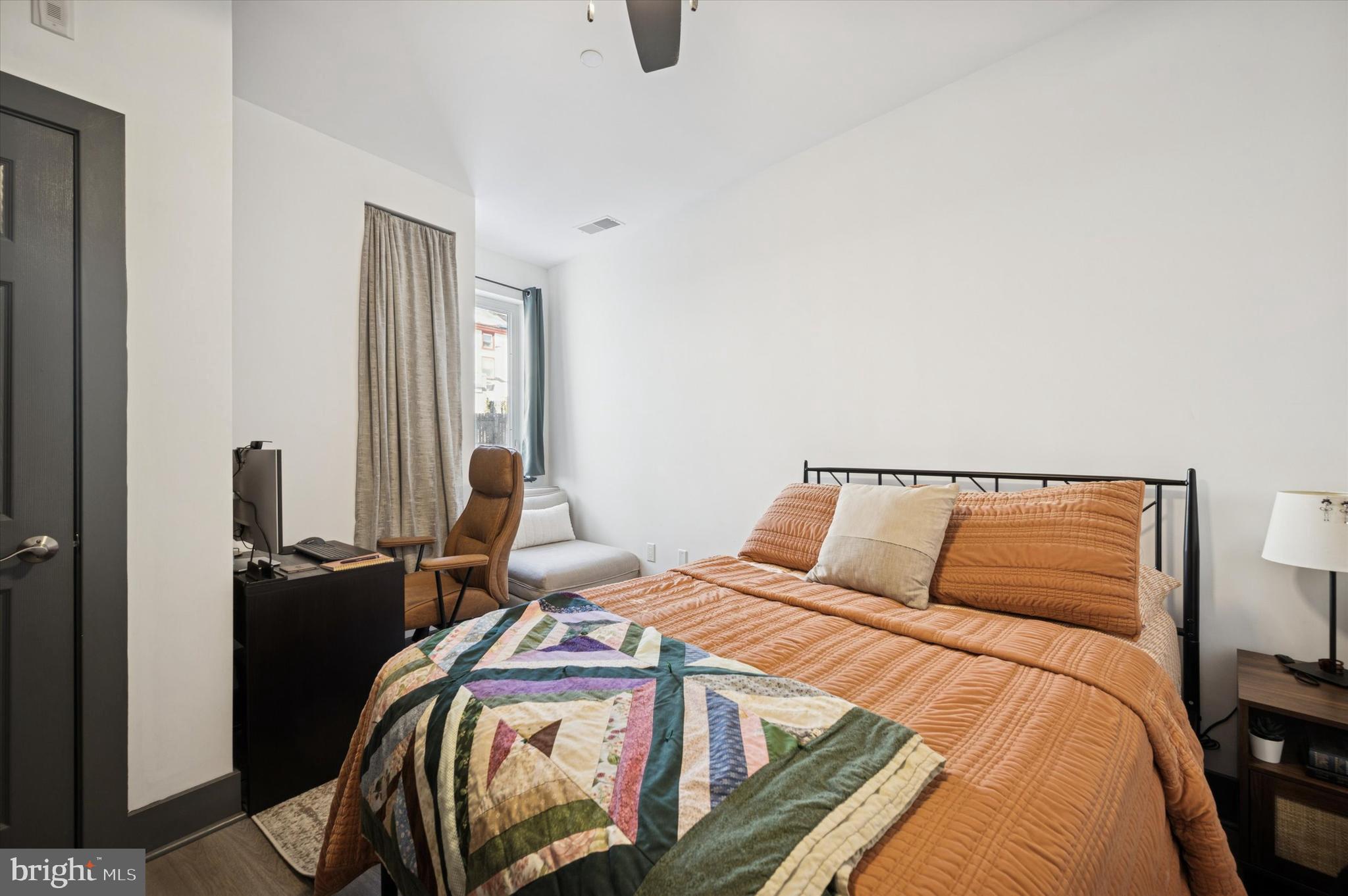 124-28 Levering Street, Unit 2B Philadelphia, PA 19127 - Photo 14 of 21 a bedroom with a bed and dresser