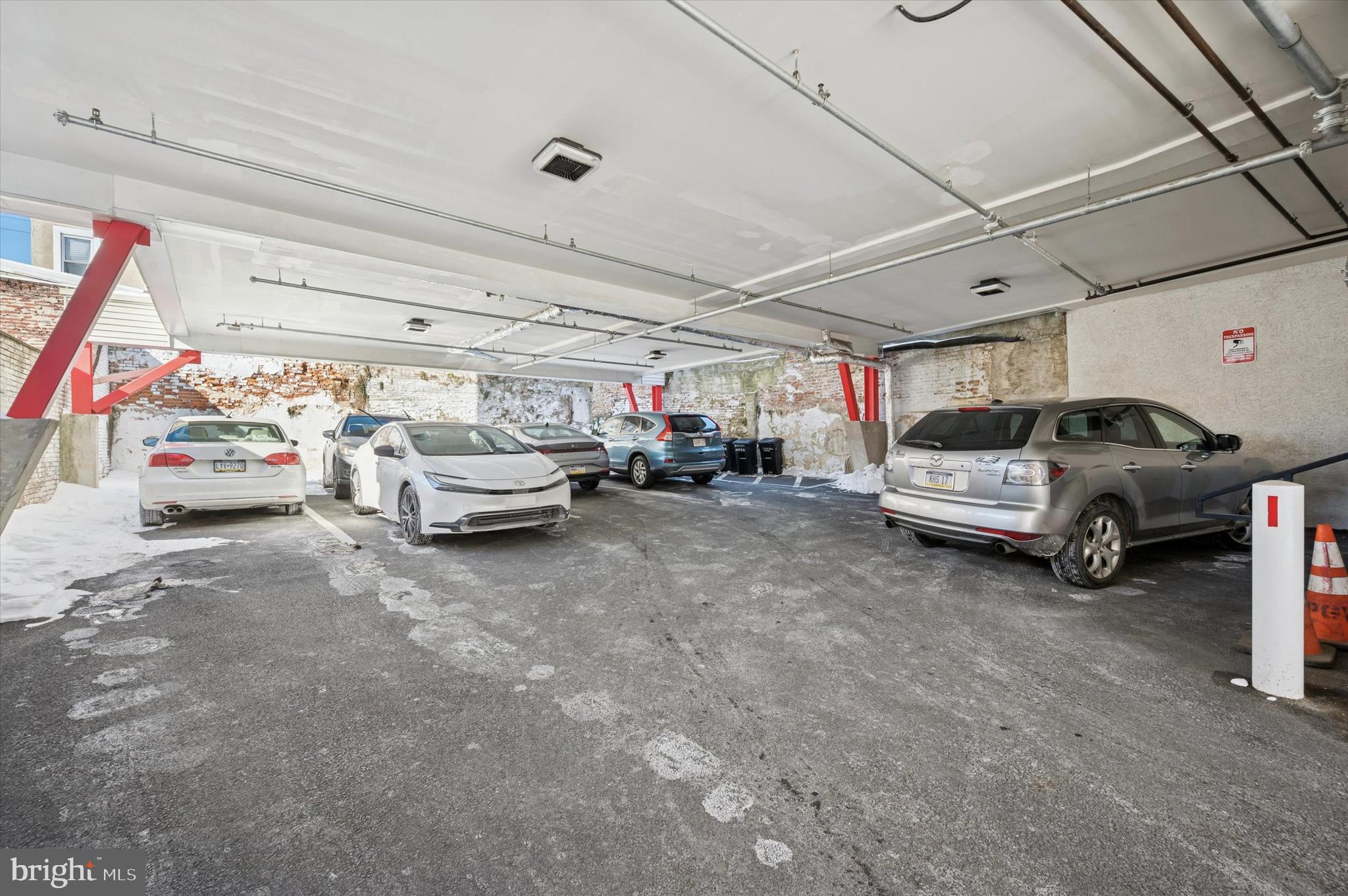 124-28 Levering Street, Unit 2B Philadelphia, PA 19127 - Photo 16 of 21 a view of parking garage with cars and other equipment
