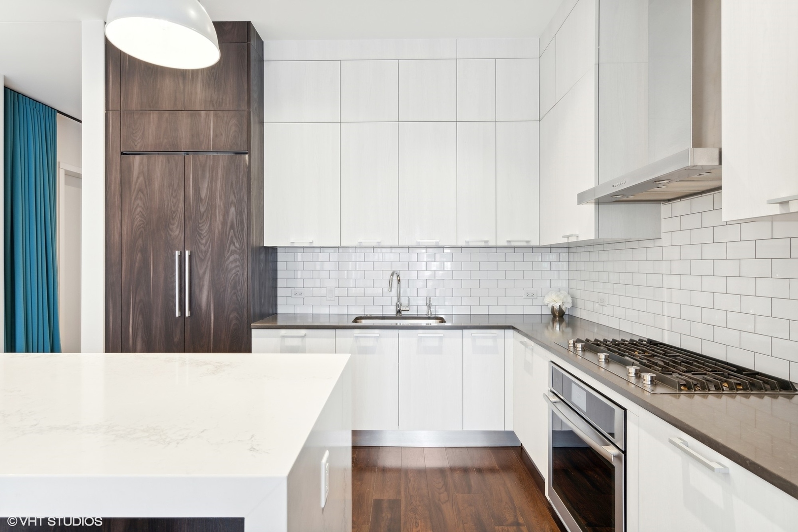 35 North Aberdeen Street, Unit PHS Chicago, IL 60607 - Photo 11 of 38 a kitchen with kitchen island granite countertop a sink stove and cabinets