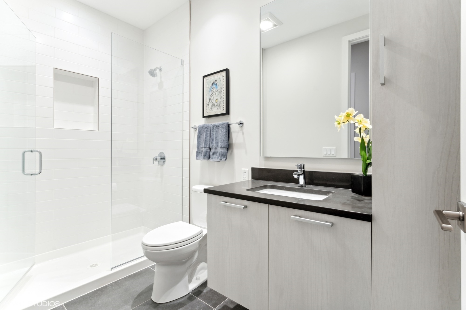 35 North Aberdeen Street, Unit PHS Chicago, IL 60607 - Photo 28 of 38 a bathroom with a granite countertop sink a toilet and a mirror
