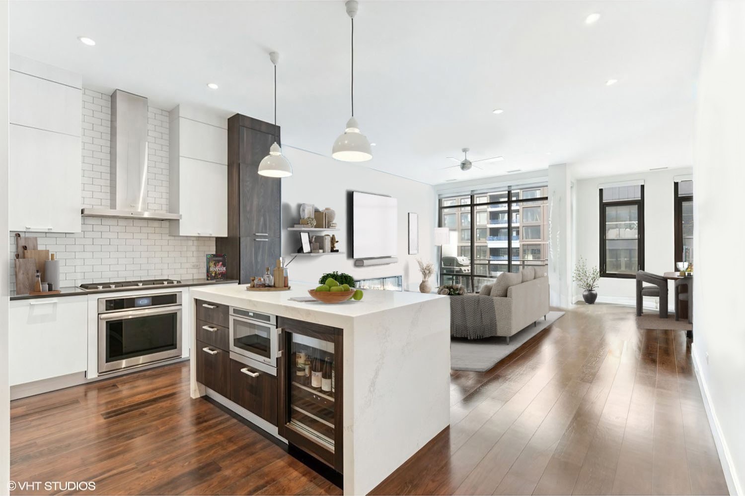 35 North Aberdeen Street, Unit PHS Chicago, IL 60607 - Photo 3 of 38 a kitchen with stainless steel appliances granite countertop wooden floors and white cabinets