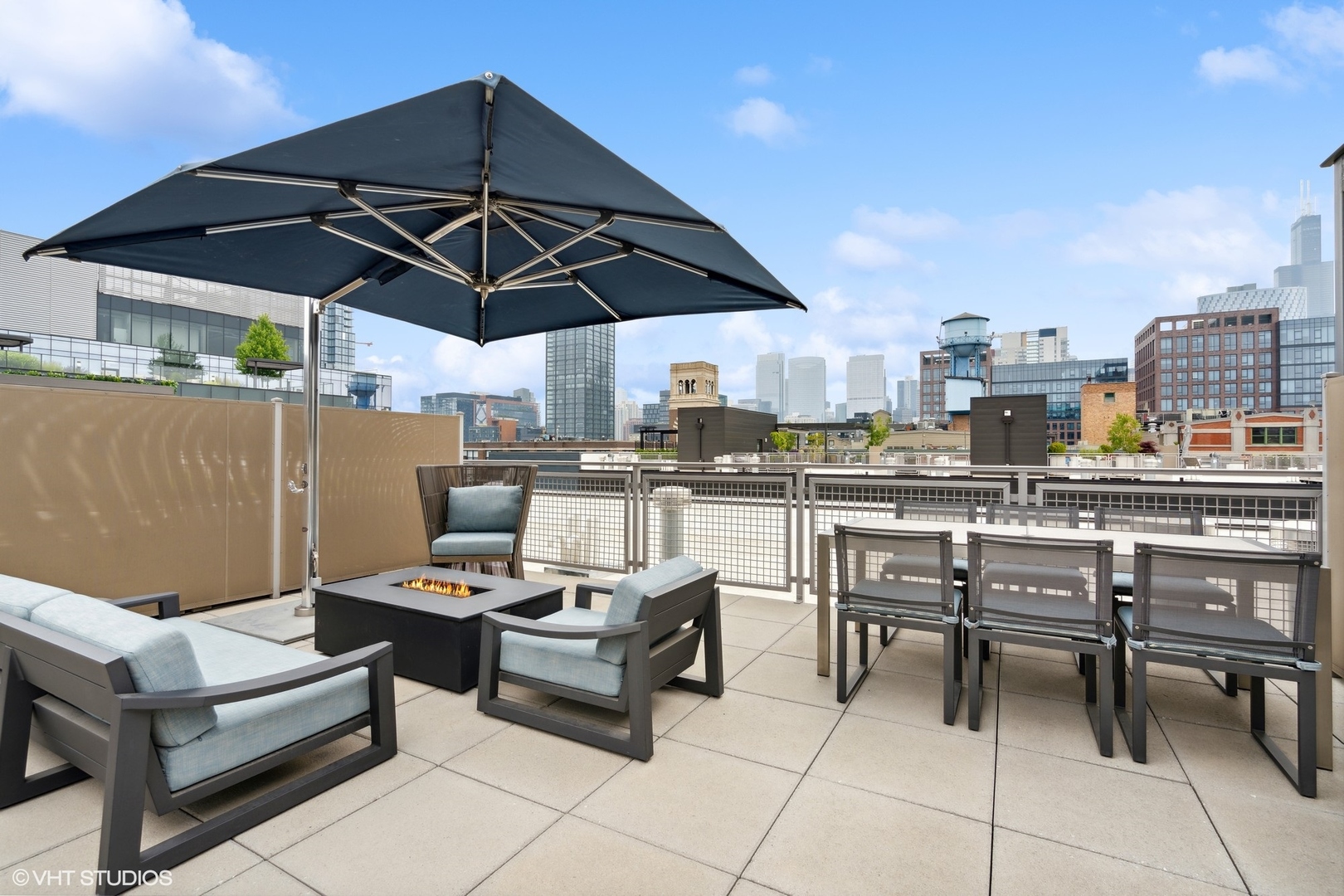 35 North Aberdeen Street, Unit PHS Chicago, IL 60607 - Photo 32 of 38 a view of a terrace with furniture and umbrella