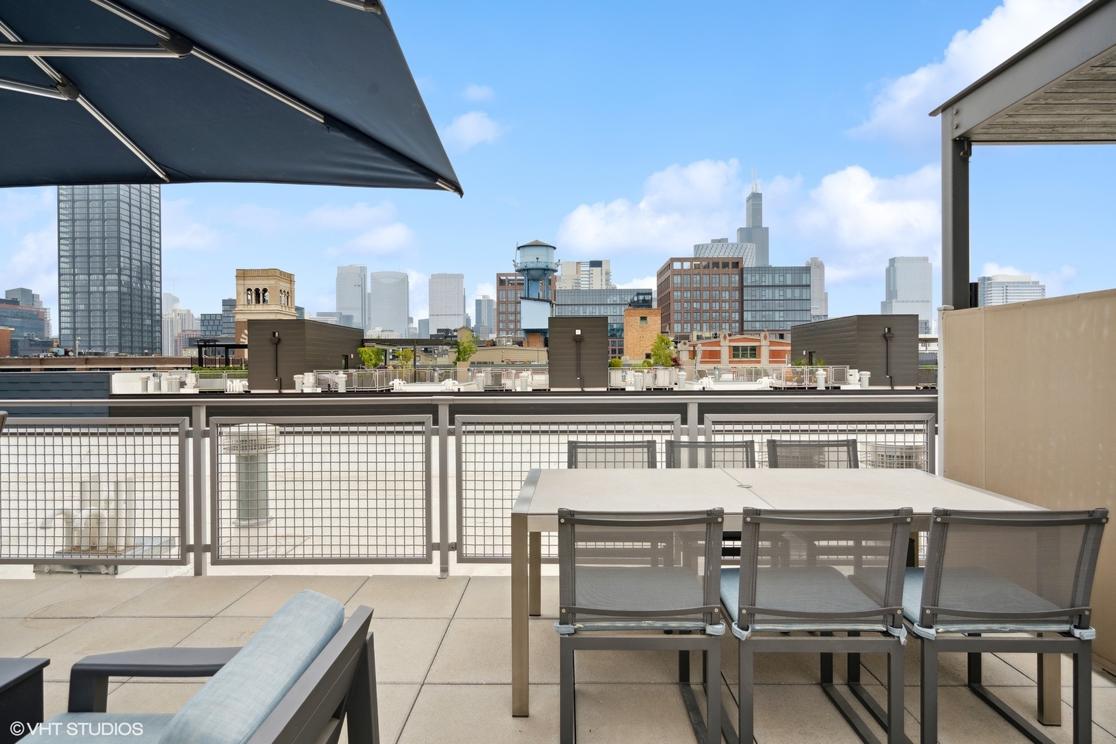 35 North Aberdeen Street, Unit PHS Chicago, IL 60607 - Photo 35 of 38 a view of a balcony with table and chairs