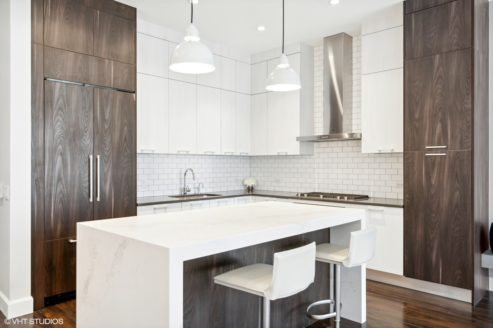 35 North Aberdeen Street, Unit PHS Chicago, IL 60607 - Photo 9 of 38 a kitchen with a table chairs sink and cabinets