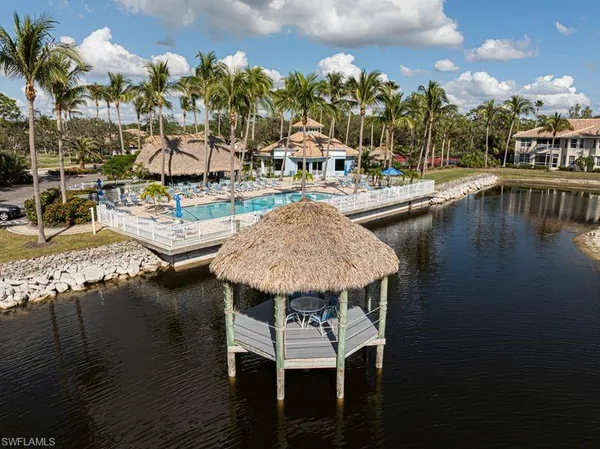 an aerial view of a house with a lake view