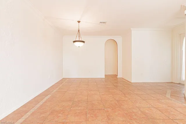 a view of a room with tiles and a large window