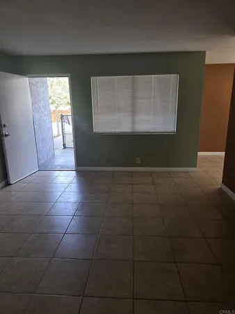 a view of hallway with window and stairs