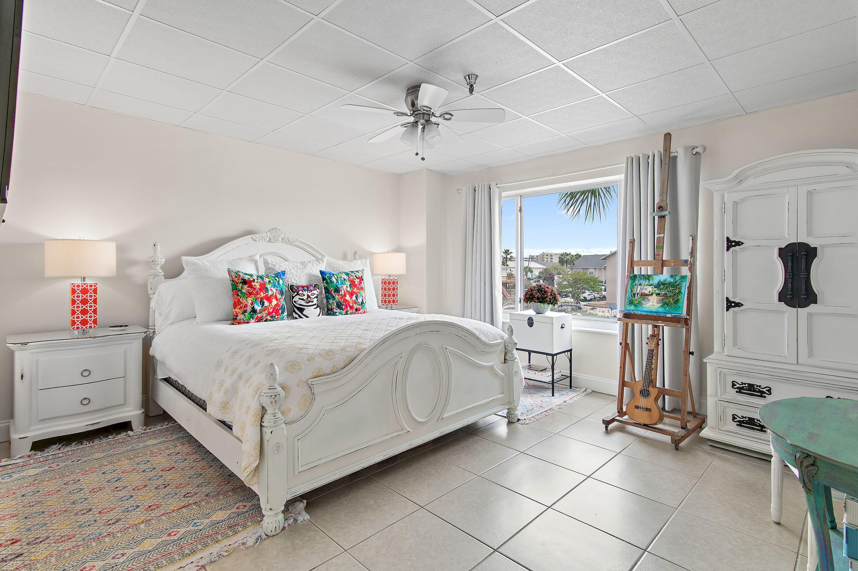 197 Durango Road, Unit 2B Destin, FL 32541 - Photo 17 of 29 a white bed sitting in a room next to a window