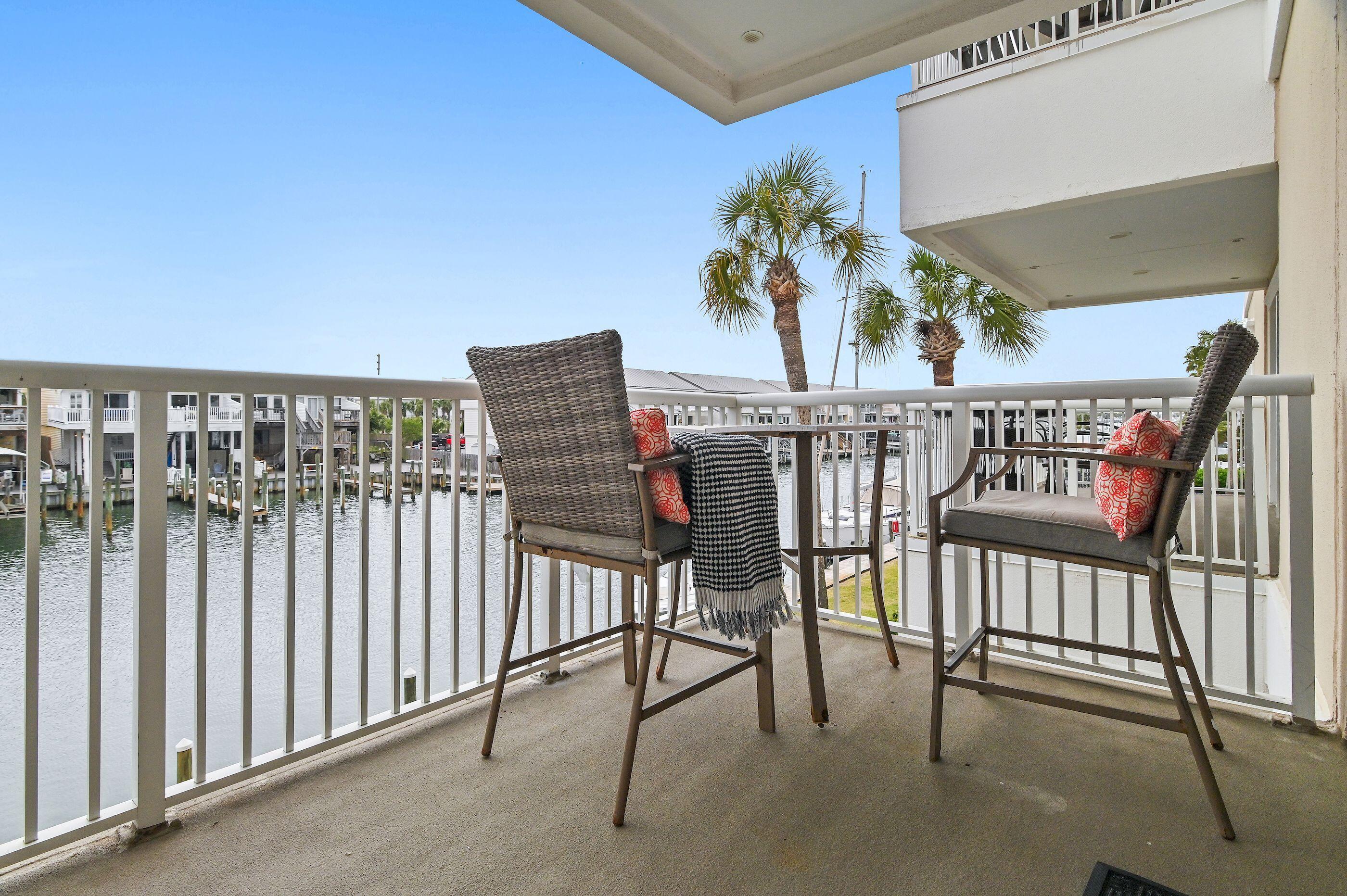 197 Durango Road, Unit 2B Destin, FL 32541 - Photo 20 of 29 a view of a balcony with chairs