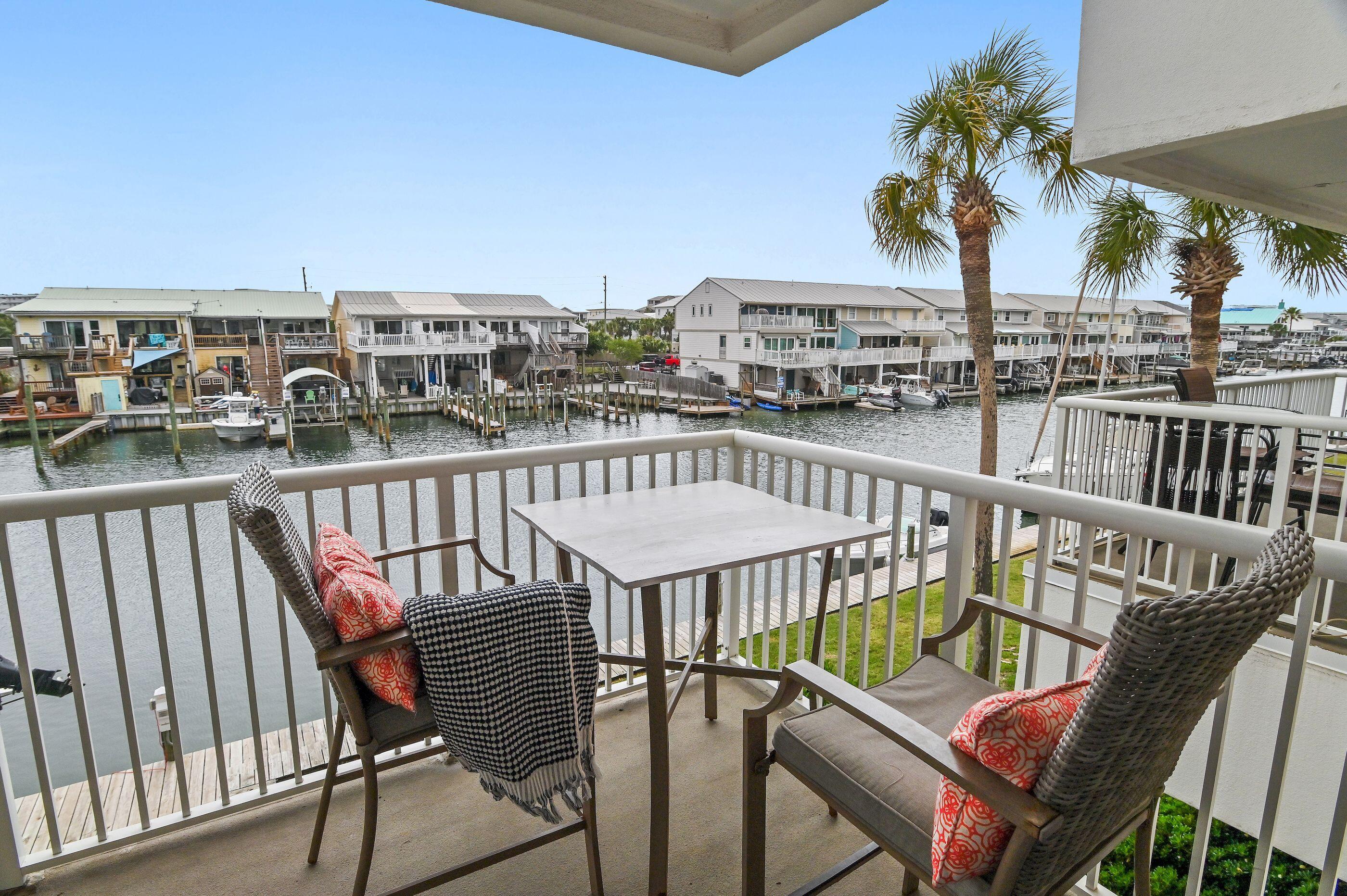 197 Durango Road, Unit 2B Destin, FL 32541 - Photo 21 of 29 a view of a balcony with chairs