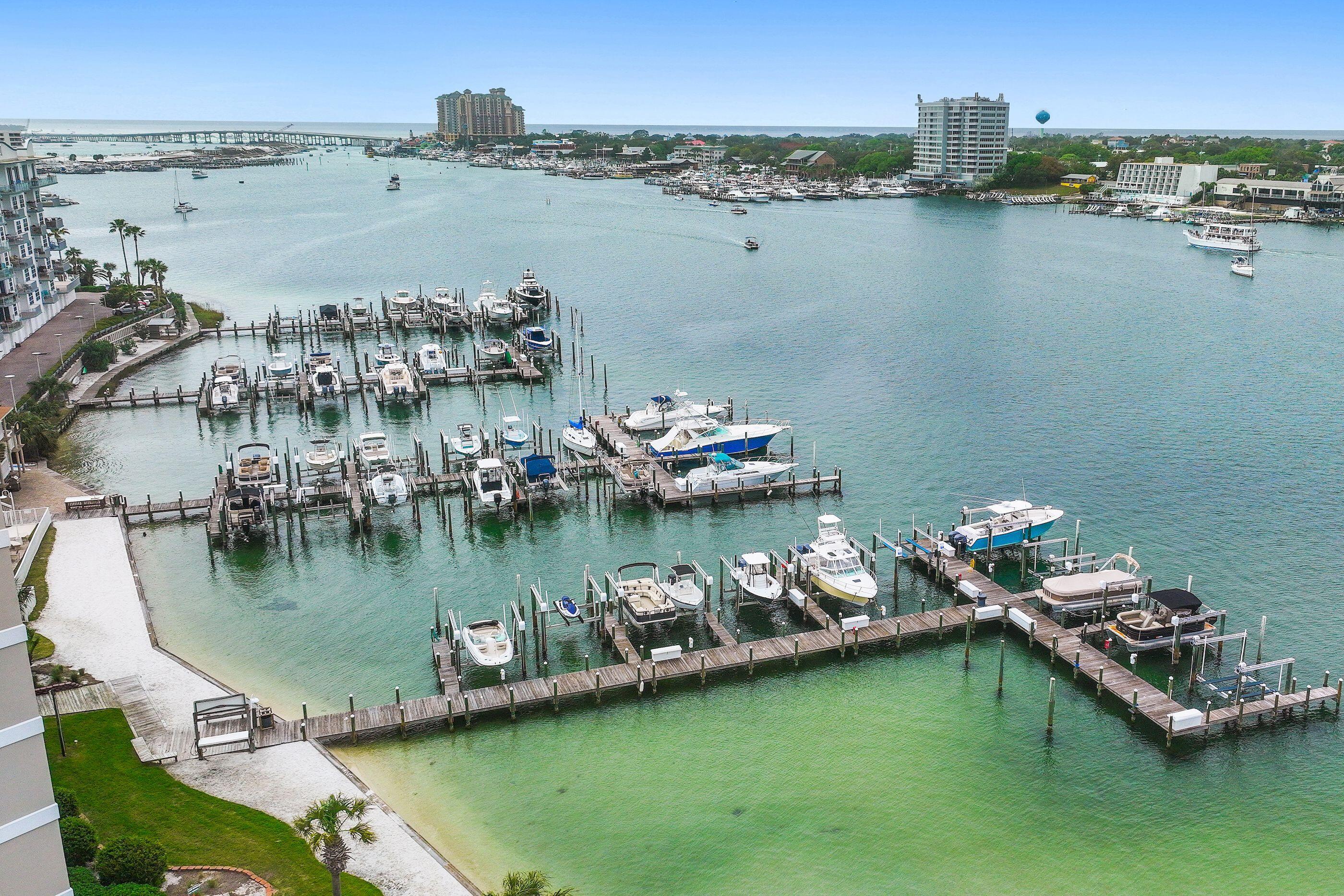 197 Durango Road, Unit 2B Destin, FL 32541 - Photo 29 of 29 a view of a lake with boats and trees in the background