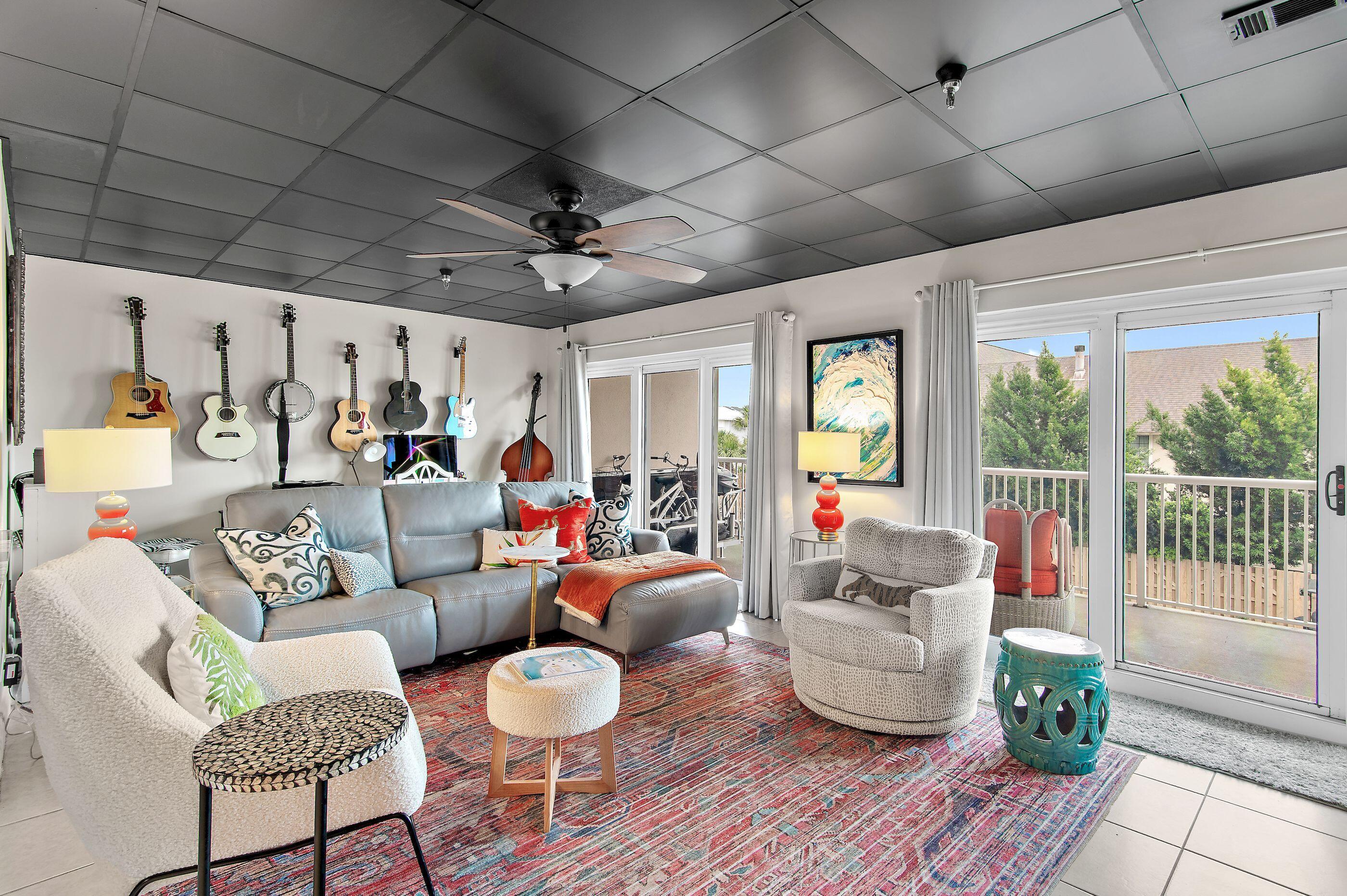 197 Durango Road, Unit 2B Destin, FL 32541 - Photo 7 of 29 a living room with furniture and a chandelier