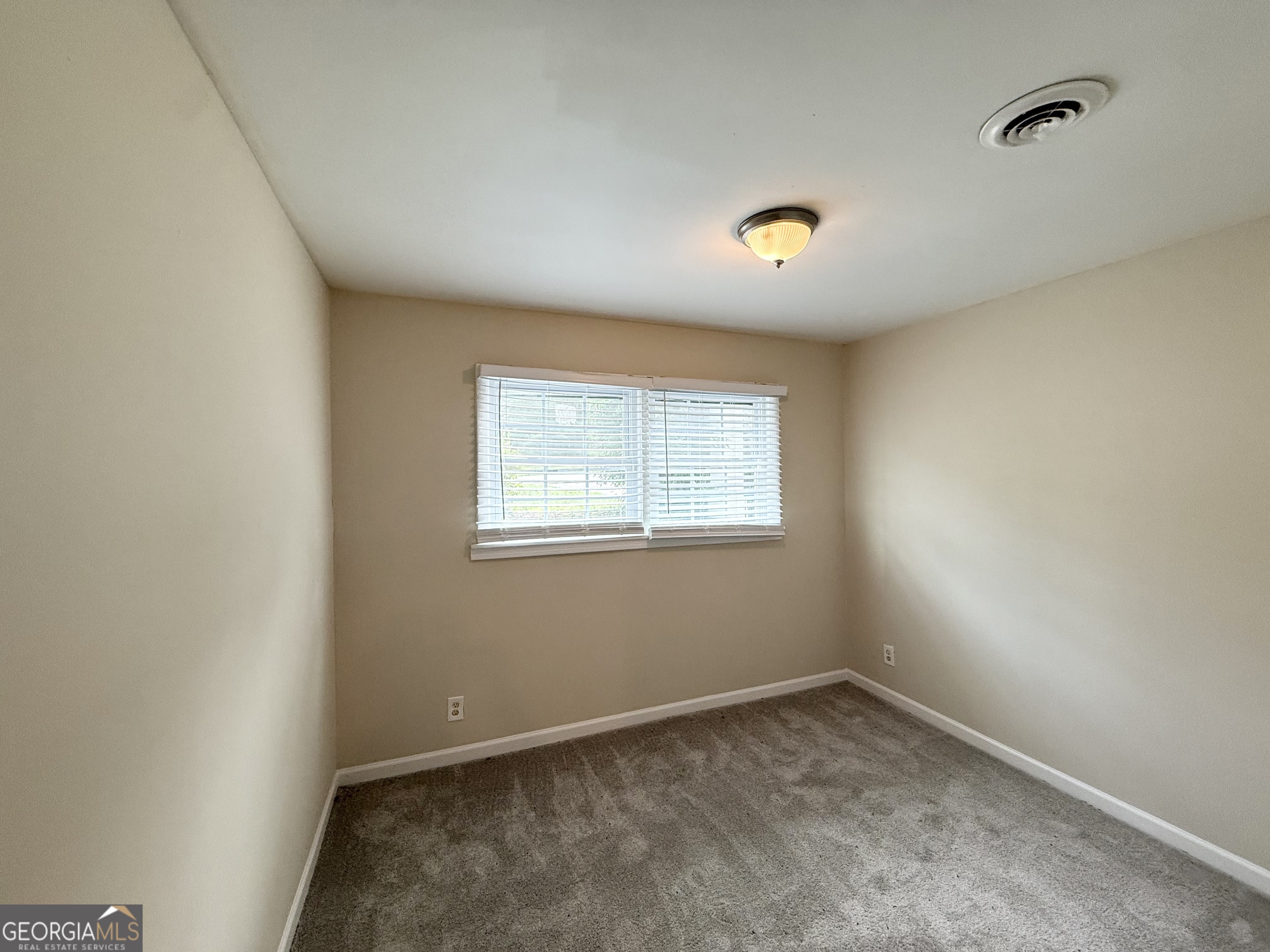 2782 Ocean Valley Road Atlanta, GA 30349 - Photo 19 of 27 an empty room with a window