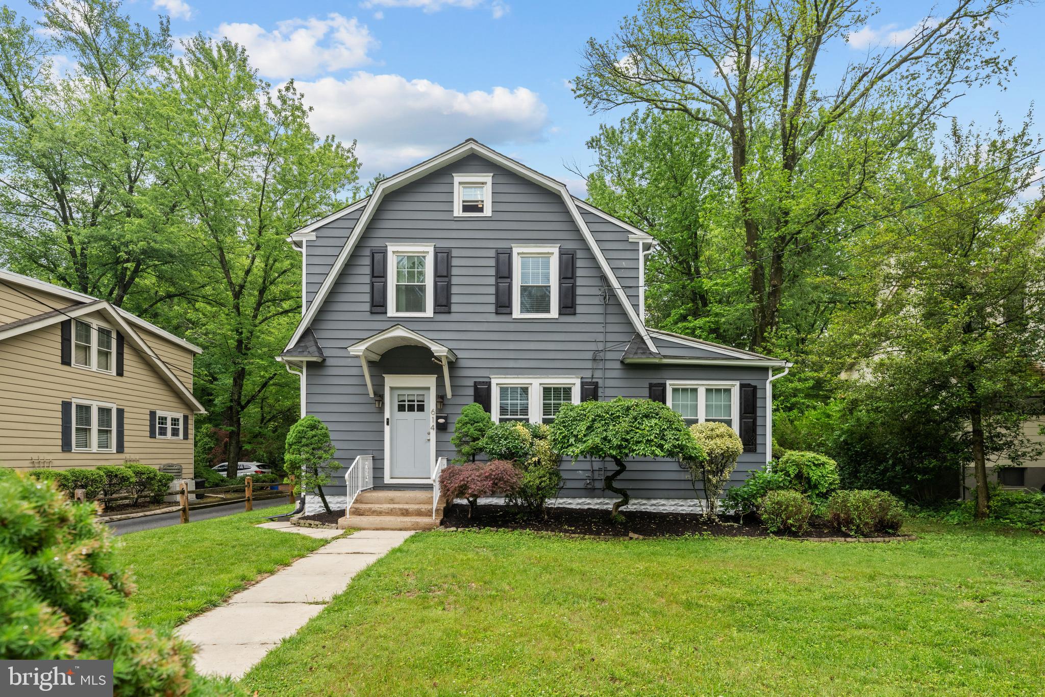 614 Maple Avenue Haddonfield, NJ 08033 - Photo 8 of 42 a front view of a house with a garden