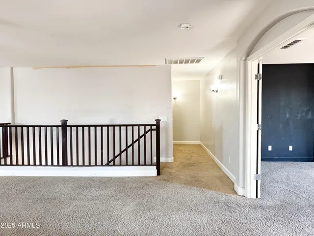 a view of room with a ceiling fan and window