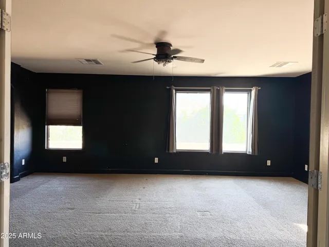 a bathroom with a bathtub a double vanity sink a vanity and mirror