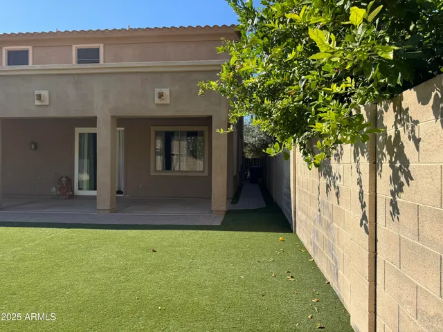 a view of a back yard of the house