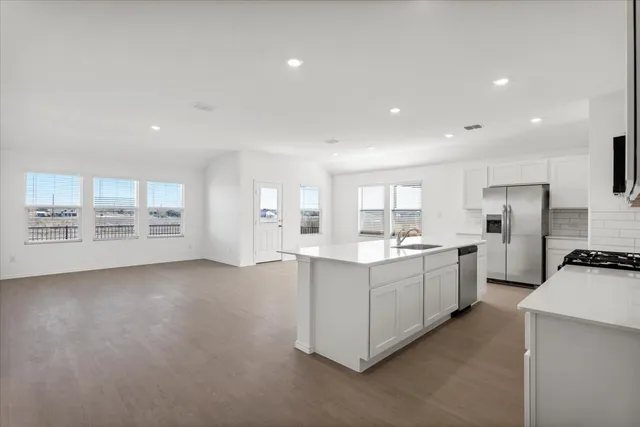 a bathroom with a tub and a sink