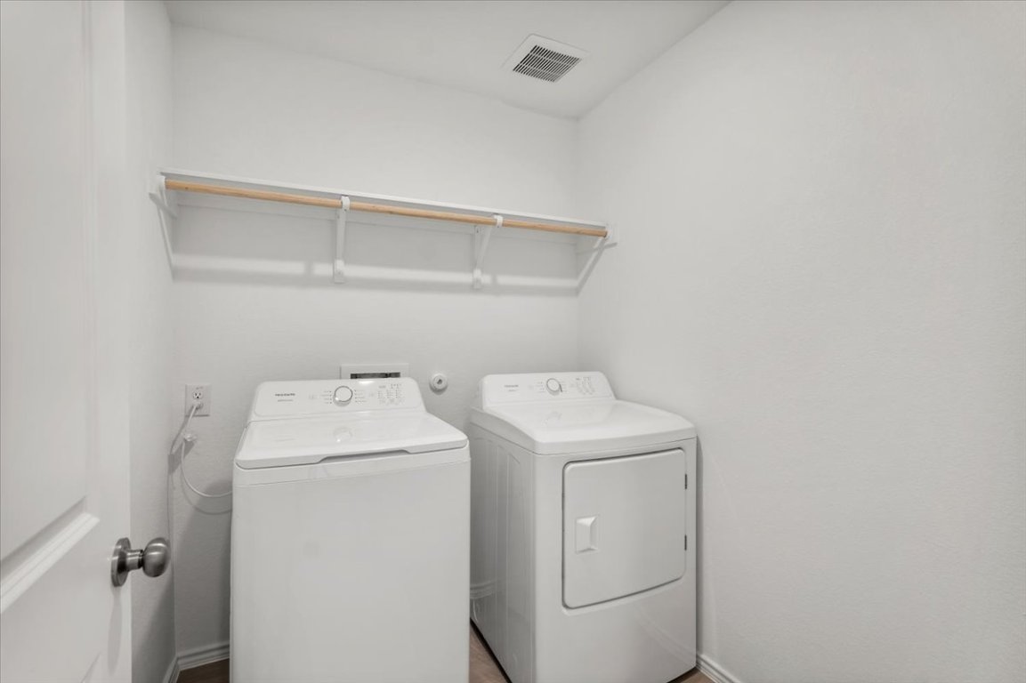 221 Rodney Boat Road Kyle, TX 78640 - Photo 15 of 33 Laundry area featuring independent washer and dryer and baseboards