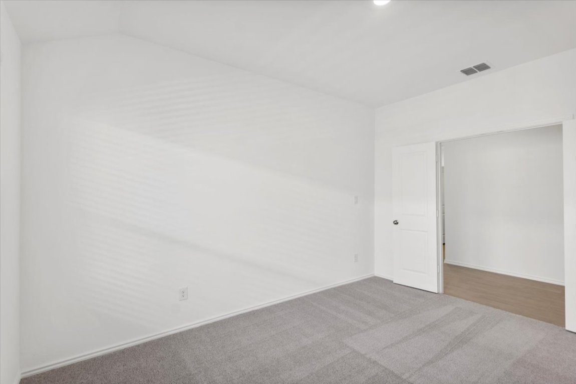 221 Rodney Boat Road Kyle, TX 78640 - Photo 17 of 33 Carpeted empty room with baseboards