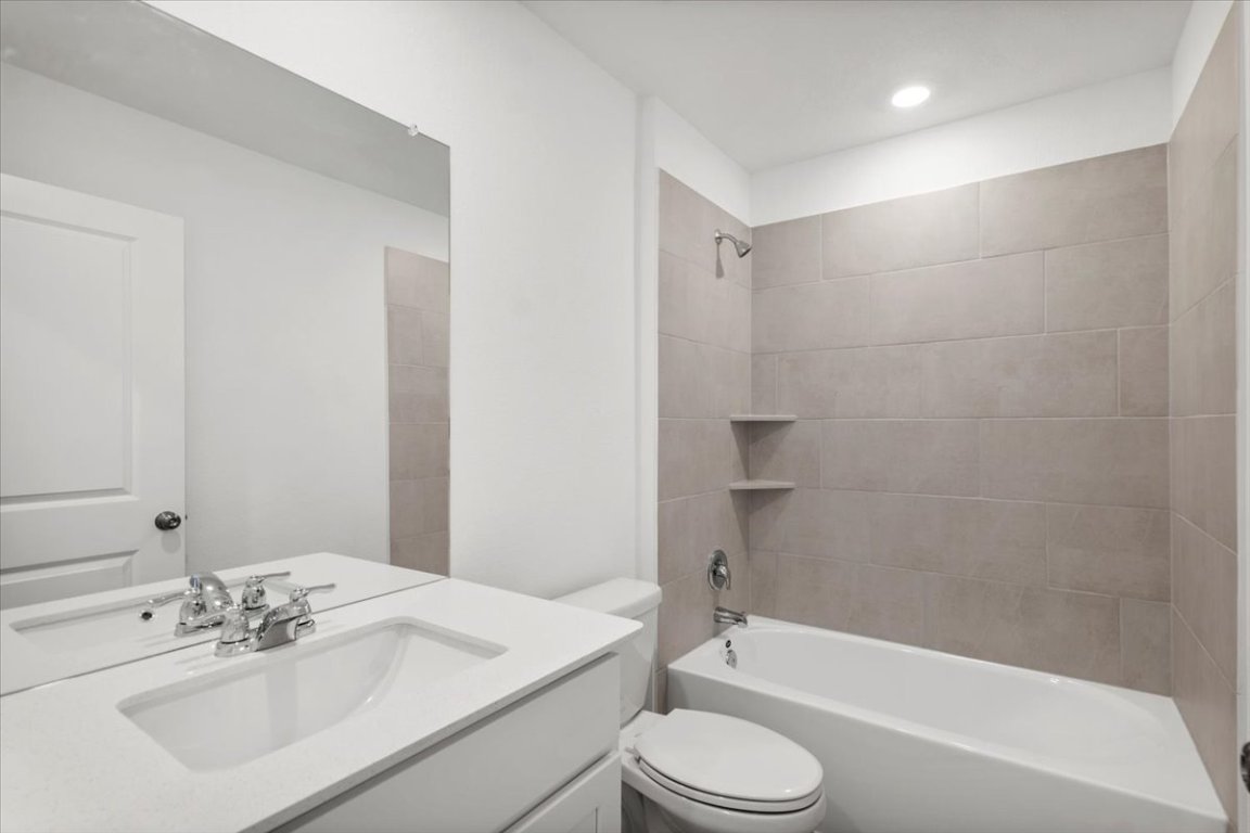 221 Rodney Boat Road Kyle, TX 78640 - Photo 19 of 33 Full bathroom with bathing tub / shower combination and vanity