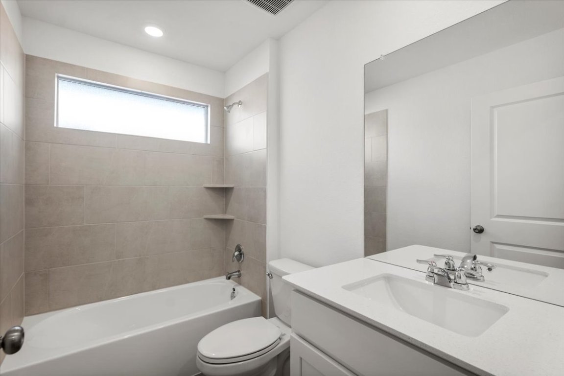 221 Rodney Boat Road Kyle, TX 78640 - Photo 23 of 33 Bathroom with shower / bathtub combination and vanity