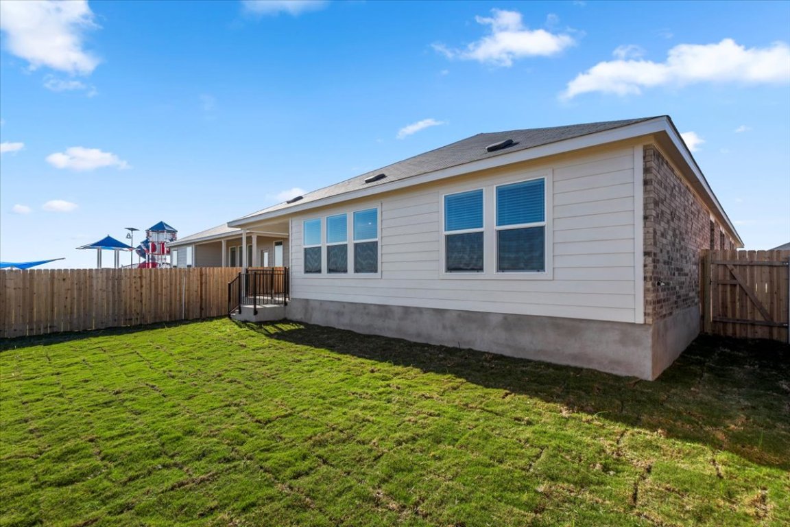 221 Rodney Boat Road Kyle, TX 78640 - Photo 6 of 33 Back of house with a fenced backyard