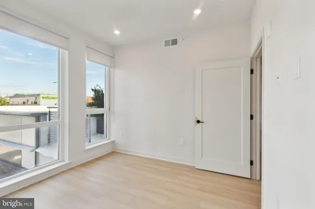 a close view of a utility room with dryer and washer