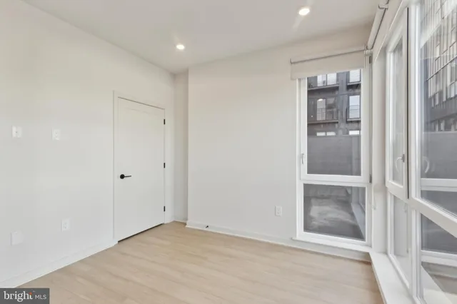 a living room with lots of furniture and a chandelier