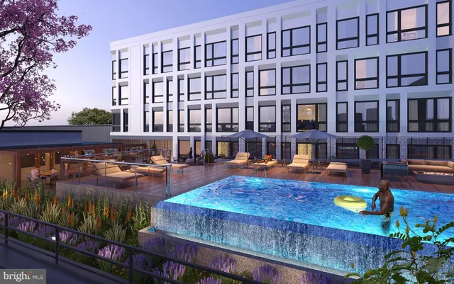 a view of swimming pool with outdoor seating