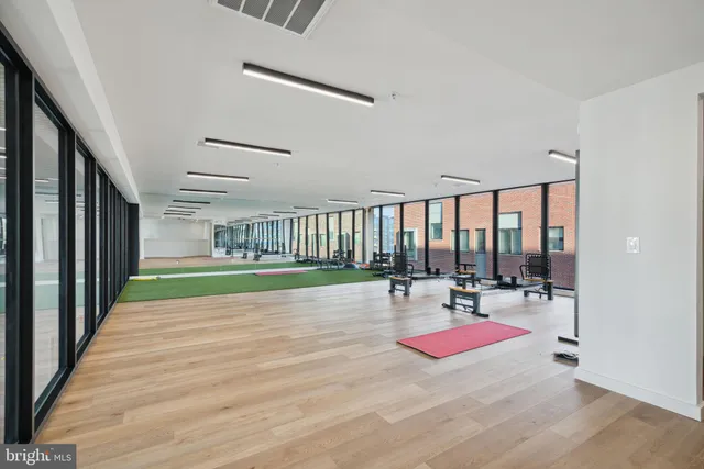 a lobby with furniture and flat screen tv