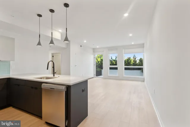 a view of kitchen and kitchen with a refrigerator