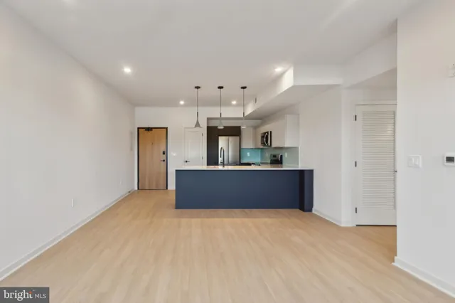 a big room with closet and windows