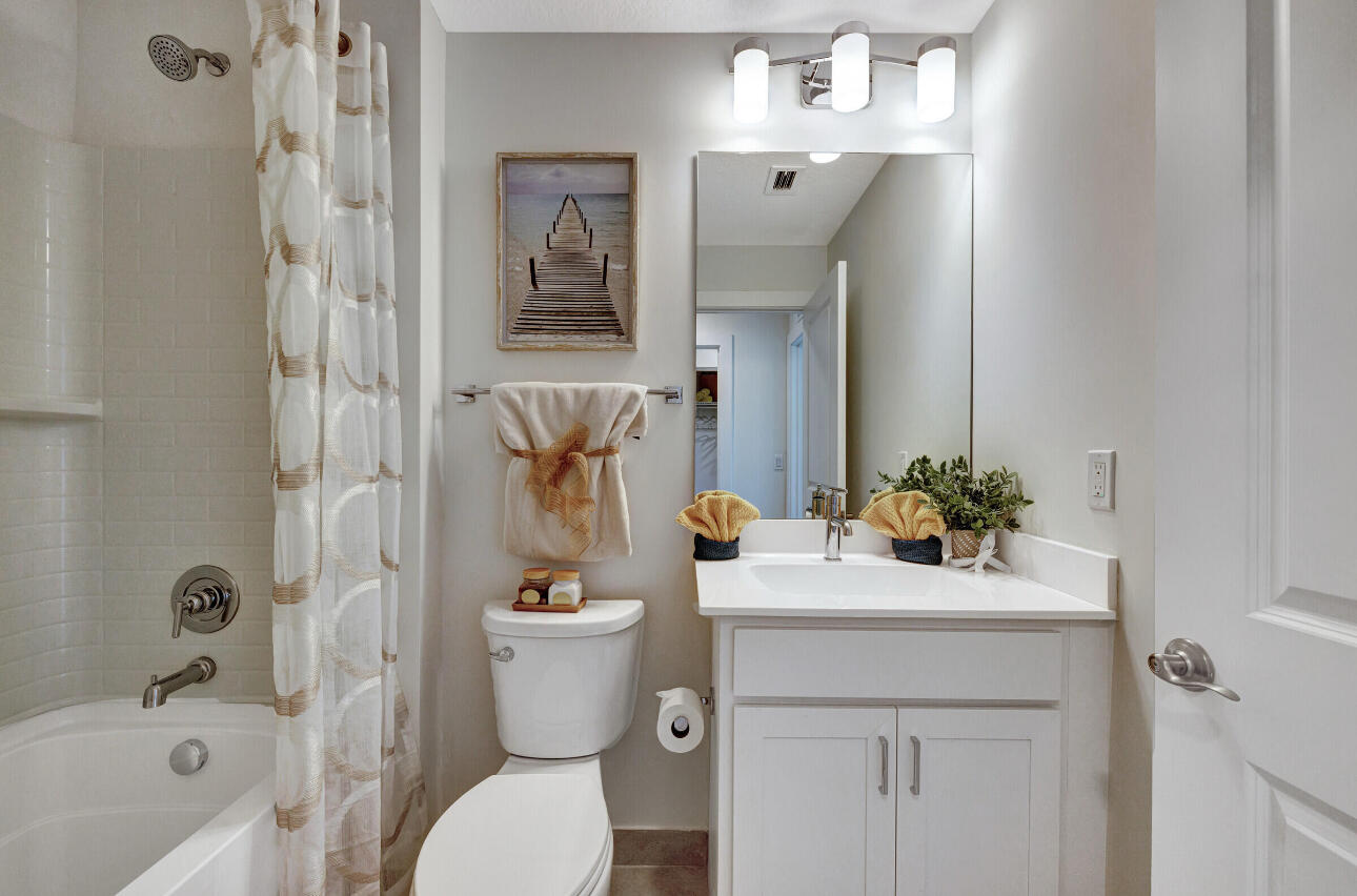 608 Waters Edge Lane, Unit 2202 Port St. Lucie, FL 34983 - Photo 19 of 19 a bathroom with a sink a toilet and shower